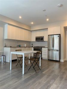 Kitchen Area with Cupboards and Sitting Arrangements