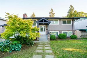 Front view of the house and outside garden