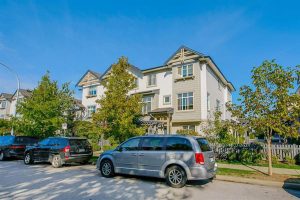 Townhouse with Cars parked on road
